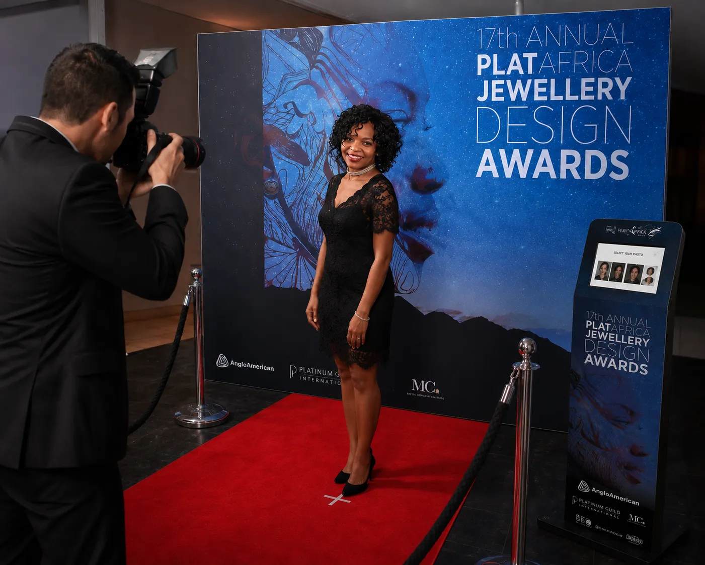 Photographer Capturing a Guest on the Red Carpet with a Digital SLR Camera